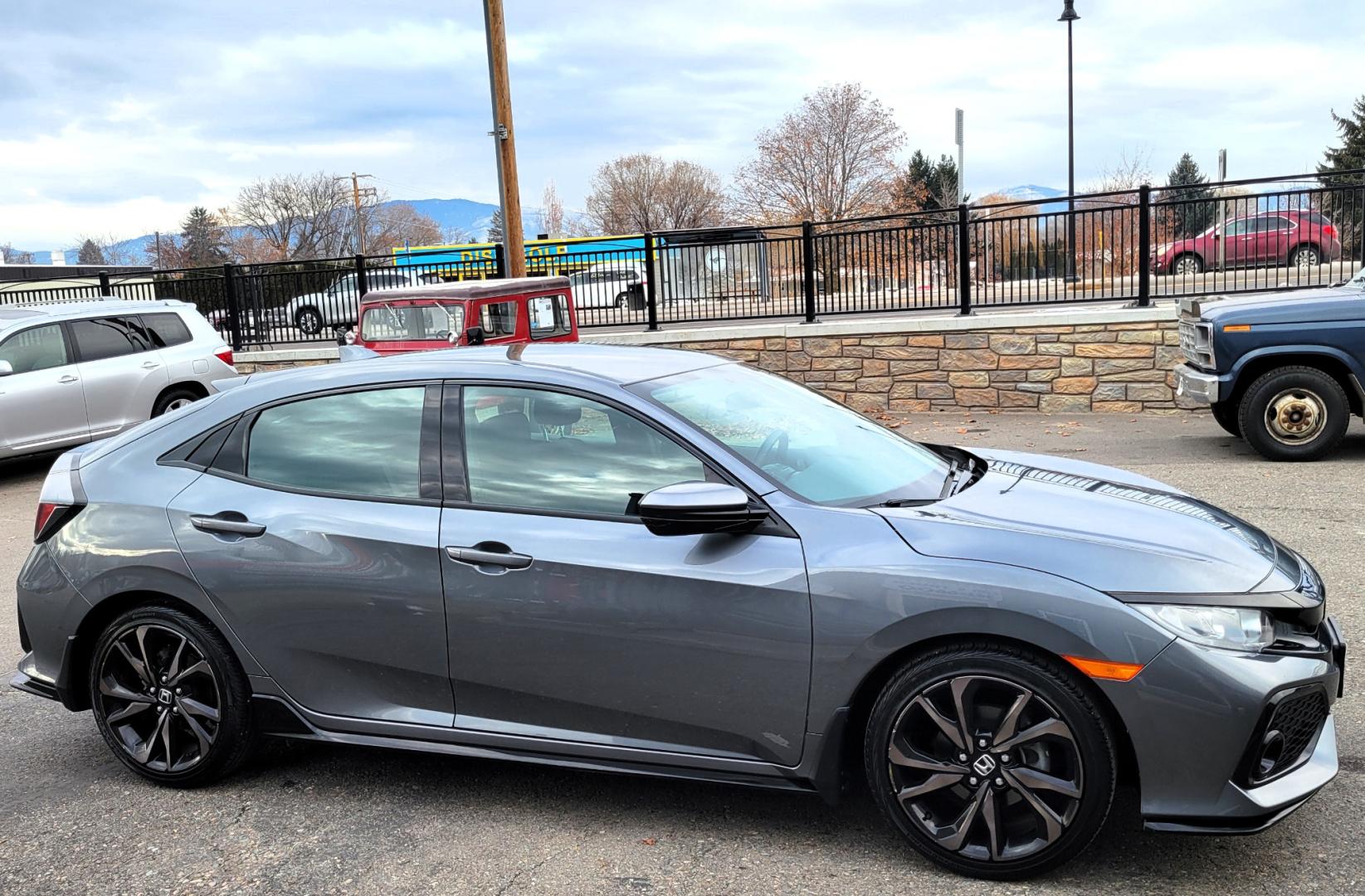 2018 Grey /Black Honda Civic Sport (SHHFK7H40JU) with an 1.5L I4 Turbo engine, Automatic transmission, located at 450 N Russell, Missoula, MT, 59801, (406) 543-6600, 46.874496, -114.017433 - Photo#4